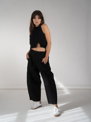 seamed curved pants in black.